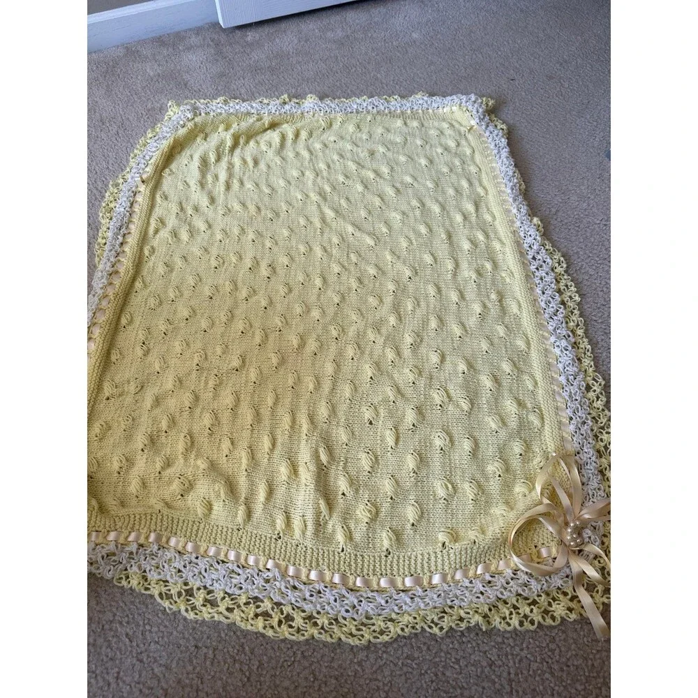 Handmade baby sweater and blankets